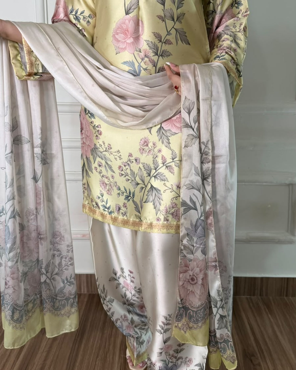 Citrine Rose two-piece suit worn — lemon-yellow rose-print kurta with ivory floral wide-leg trousers, styled with a dupatta (dupatta not included)