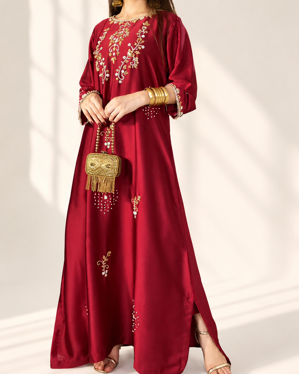 Zarina red embellished maxi dress — front detail with gold clutch