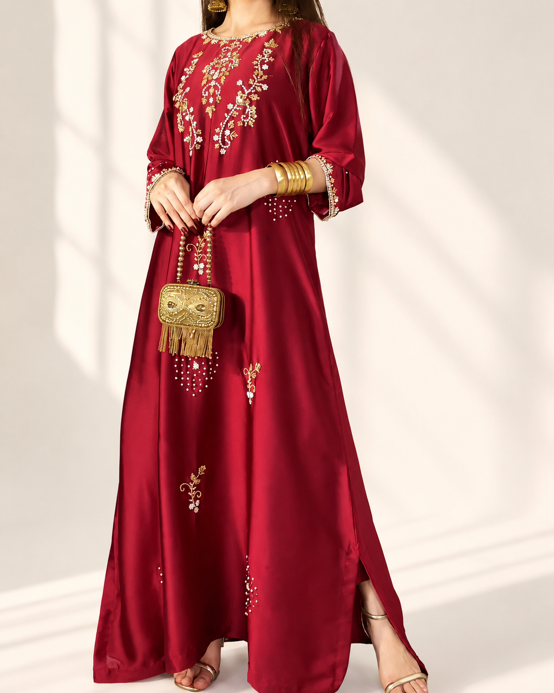 Zarina red embellished maxi dress — front detail with gold clutch